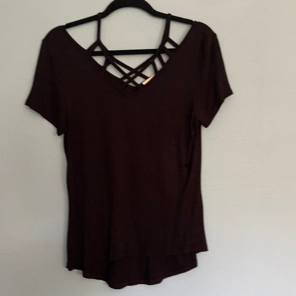 Size large black shirt with cutouts on chest one back